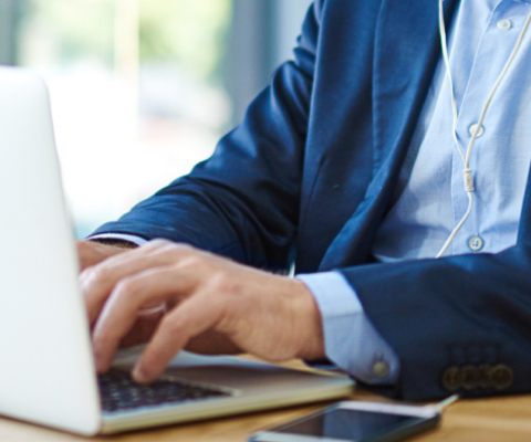 hands typing on computer